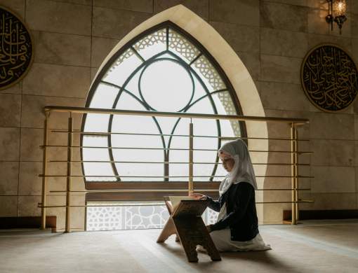 Tennessee Iqra' Academy teacher guiding a student through the Quran